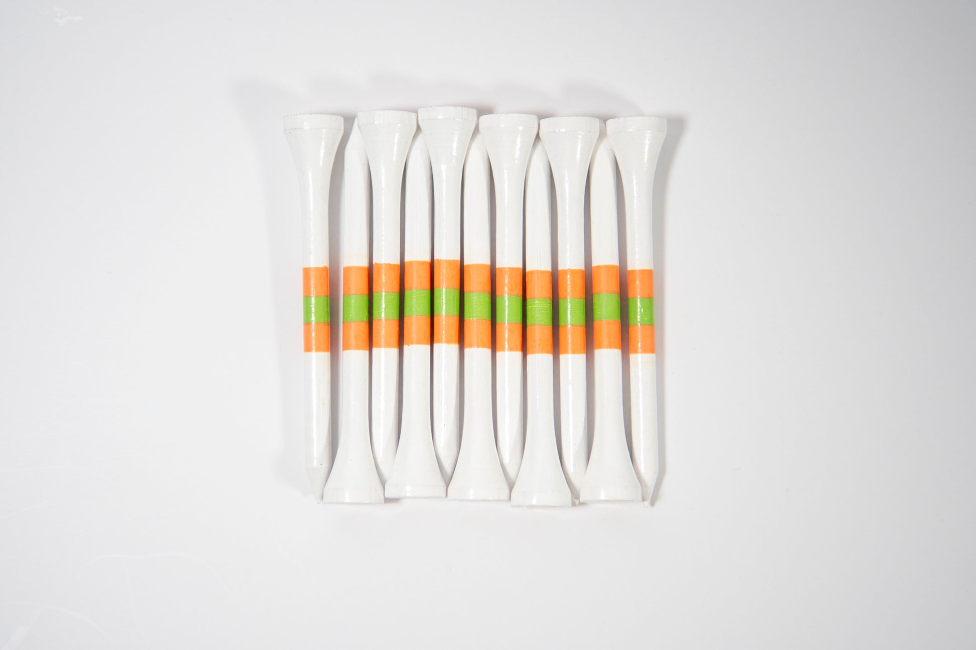 "Absolute Peach" golf tees, tee striping